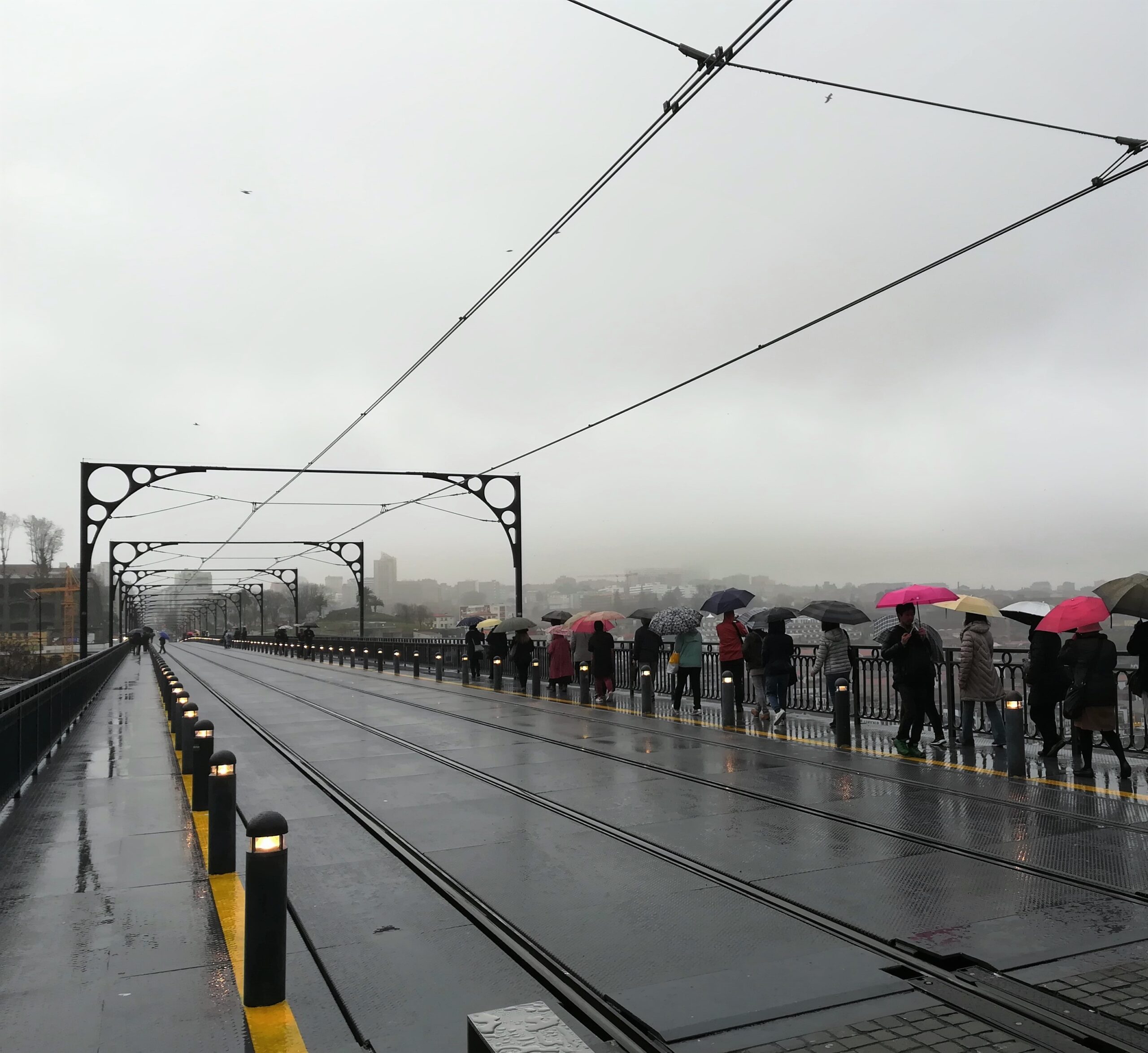 rainy day tourist on dom luís 